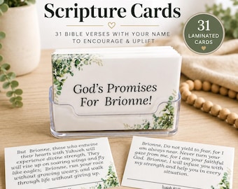 May include: A set of 31 personalized laminated scripture cards in a clear plastic holder. The cards feature white backgrounds with green eucalyptus leaf accents. The top card reads God's Promises For Brionne! with two additional cards displaying Isaiah 40:31 and Isaiah 41:10 verses.