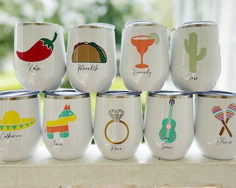 May include: Ten white stainless steel wine tumblers with various Mexican-themed designs and names on each. The designs include a chili pepper, a taco, a margarita, a cactus, a sombrero, a pinata, a ring, a guitar, and maracas.