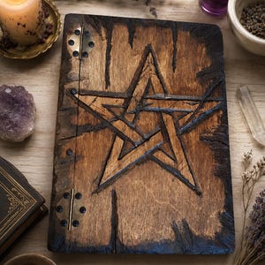 Book of Shadows with distressed pentagram design and blank pages.