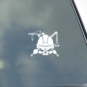 May include: White vinyl decal of a skull wearing a construction helmet with two cranes crossed behind it.