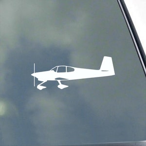May include: White silhouette of a small airplane with a single propeller on a clear background.