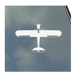 May include: White silhouette of a small airplane with a single propeller on a gray background.