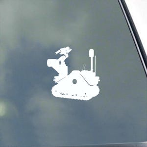 May include: White silhouette of a military robot with a gun turret and tracks on a blue background.