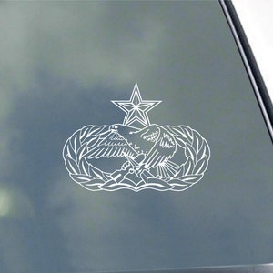May include: White vinyl decal of the Air Force Space Command emblem. The emblem features a star, a laurel wreath, and an eagle with wings spread.