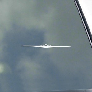 May include: A white silhouette of a stealth bomber aircraft on a gray background.