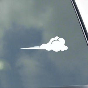 May include: A white vinyl decal of a stylized cloud with speed lines, suggesting motion. The cloud has a rounded shape with several circular segments. The decal is designed to be applied to a car window or other smooth surface.