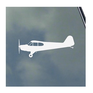May include: White silhouette of a small airplane with a propeller on a blue background.