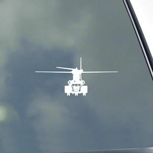 May include: White helicopter decal with detailed design, featuring a main rotor and tail rotor. The decal is a silhouette, perfect for application on vehicles or other surfaces. The background is a gradient of gray and white.