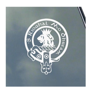 May include: White vinyl decal of a Scottish clan crest featuring a lion's head with a crown and the text "Mo Dhreamh S Rioghal".