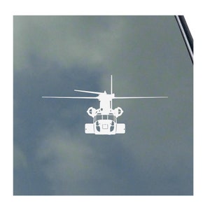 May include: White silhouette of a helicopter with detailed rotor blades and body. The image is a clean, minimalist design, likely a decal or sticker, against a muted gray background. The helicopter is centered.