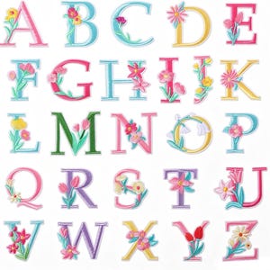 May include: A complete set of twenty-six embroidered alphabet letter patches, each featuring unique floral motifs in various colours including pink, yellow, blue, green, and purple. The letters are arranged in rows, showcasing diverse botanical designs integrated into each character.