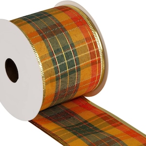 May include: A roll of plaid ribbon with gold trim. The ribbon is orange, green, and red with a gold metallic edge.