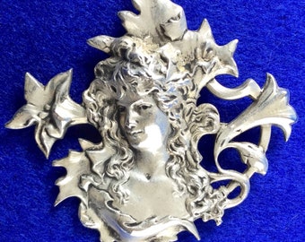 Art Nouveau Brooch depicting Mucha Era Girl With Lilies