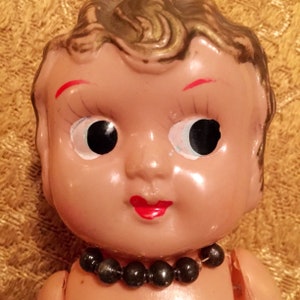 Vintage 1930s Celluloid Plastic Doll Made in Occupied Japan . Blonde Finger Wave Hair and jointed arms, plus Original Necklace
