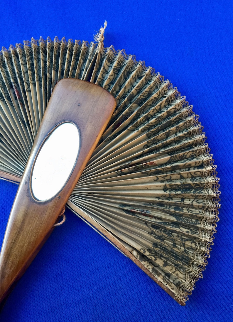 Late Victorian Ricardo Cockade Screen Flirting Fan with hand painted bird and bevelled oval mirror.