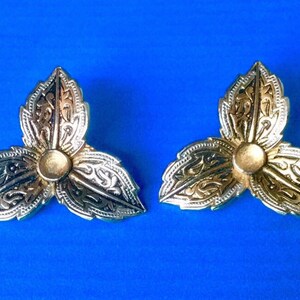 Damascene Clip On Earrings featuring a Trefoil Flower