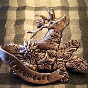1930s Austrian Tirolean Souvenir Brooch from Westendorf with Stags Head in Pressed Tin