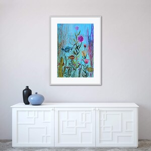 May include: A framed watercolor painting of a whimsical underwater scene with colorful fish, flowers, and plants on a blue background.