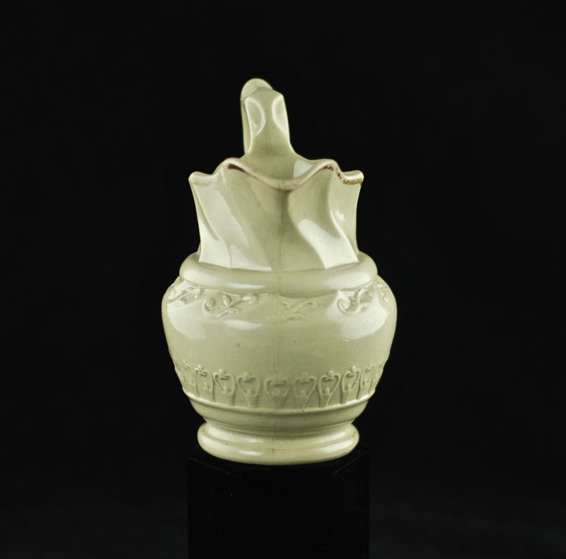 Antique Art Nouveau Ceramic Pitcher with Molded Body and Scalloped Neck and Handle