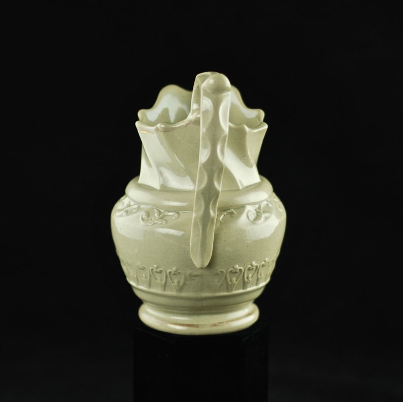 Antique Art Nouveau Ceramic Pitcher with Molded Body and Scalloped Neck and Handle