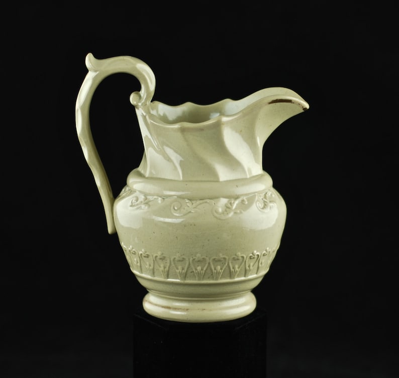 Antique Art Nouveau Ceramic Pitcher with Molded Body and Scalloped Neck and Handle