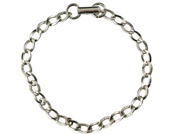 Vintage sterlingzilveren schakelarmband met getextureerde en gepolijste schakels