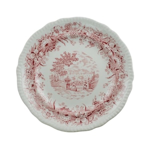 May include: White ceramic plate with a scalloped edge and a red floral and landscape design. The plate features a detailed border of flowers and a central scene with figures and trees, creating a classic, elegant aesthetic.