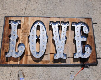 Love metal letter marquee sign with bulbs. Any font. Great for weddings and as gifts. Custom sizes and finishes available.