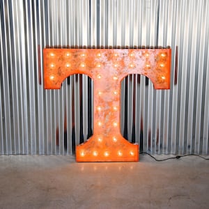 UT Power &quot;T&quot; weathered metal letter light in distinctive UT orange with globe &quot;Marquee&quot; style bulbs.