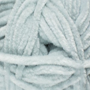May include: A skein of light blue fuzzy yarn.