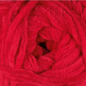 May include: A close-up of a bright red ball of yarn. The yarn is soft and fluffy, and it is ideal for crocheting or knitting.