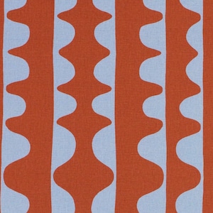May include: Close-up of a fabric with a repeating pattern of vertical, wavy lines. The lines are a warm orange-red color, and they alternate with light blue, creating a bold and eye-catching design. The fabric has a textured appearance.