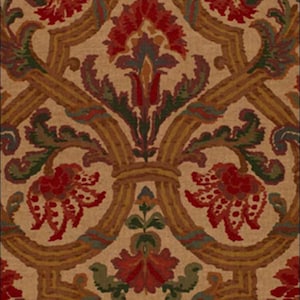 May include: A beige fabric with a repeating pattern of red, green, and brown floral designs. The pattern is intricate and features stylized leaves and flowers.