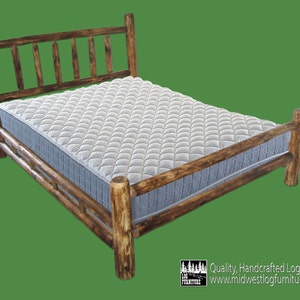 May include: A rustic wooden bed frame with a slatted headboard and footboard. The bed frame is made of natural wood with a dark brown finish. The bed frame is shown with a white mattress.