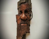 Wood carving of a wood spirit with a gnome home in his beard by Murray Watson hand carved tree spirit driftwood art wooden face ooak wood.