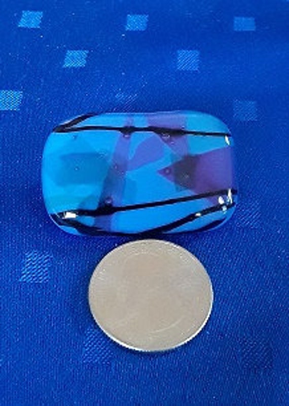 Blue, purple and green glass pin