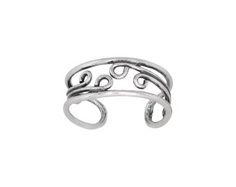 May include: Silver toe ring with a delicate, swirling design. The ring is adjustable and has a smooth finish.