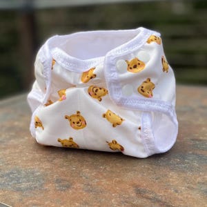 Pañal de tela para recién nacidos de Winnie the Pooh con cierre de cordón umbilical