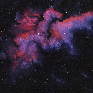 May include: A painting of a nebula in space with red, pink, and purple hues. The nebula is surrounded by a dark blue background with white stars. The artist's signature, "Margie Lucier", is visible in the lower right corner.