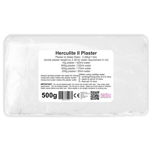 May include: A white bag of Herculite II Plaster, a sculpting material, with a label that includes instructions for mixing the plaster with water. The label also includes a warning to use the product under adult supervision and to keep it out of the reach of children. The bag is labeled with a weight of 500 grams.