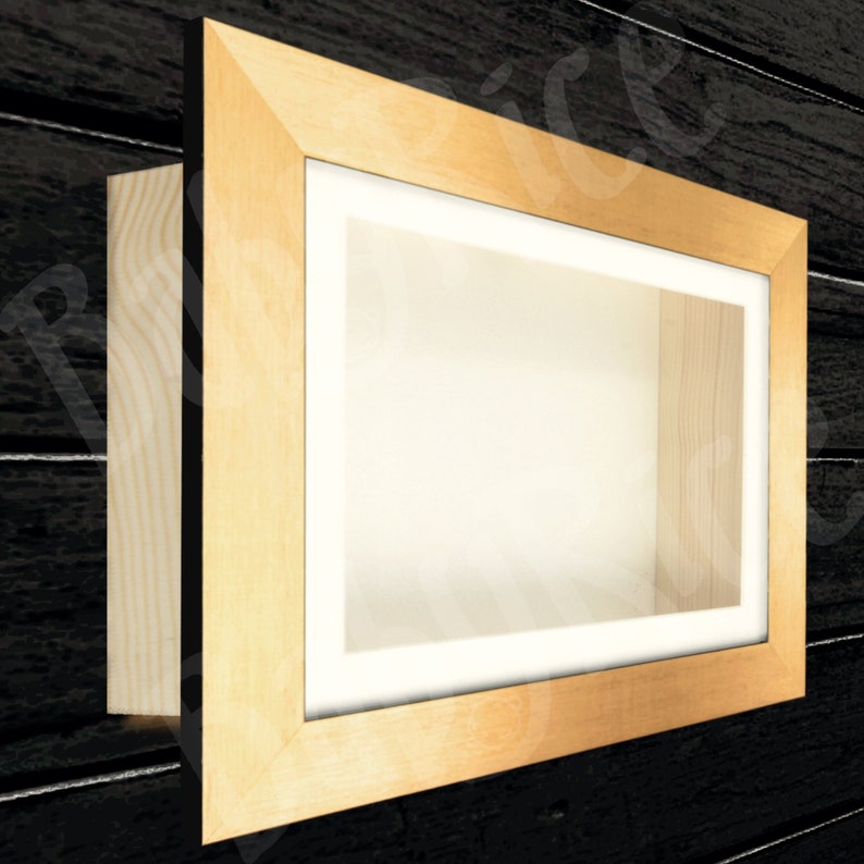 May include: A wooden shadow box with a gold frame and a white background. The box is empty and ready to be filled with your favorite items.