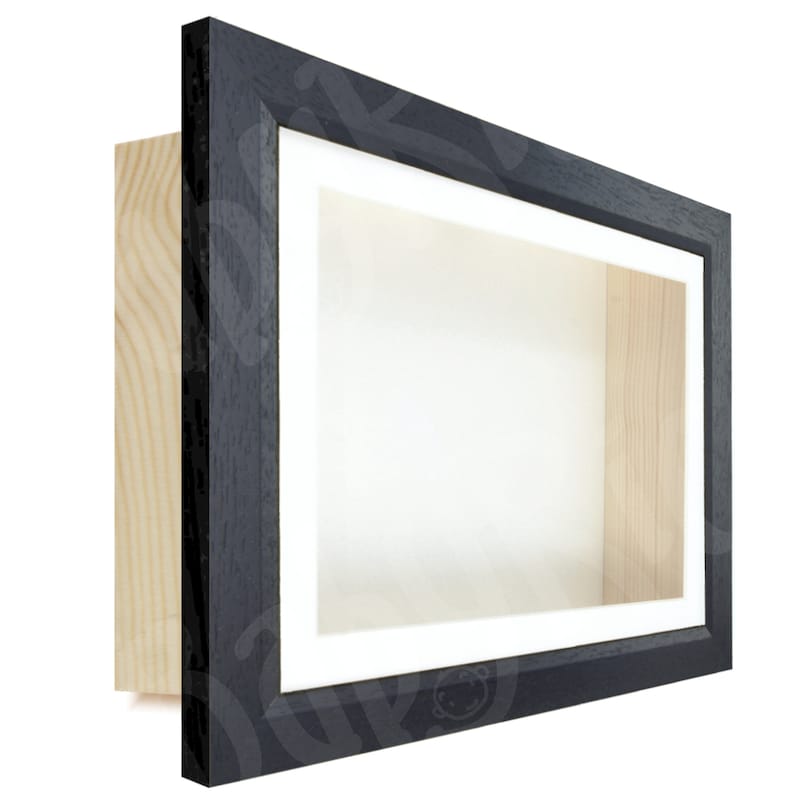 May include: A black wood shadow box frame with a white mat and a clear glass front. The frame is made of solid wood and has a sleek, modern design.