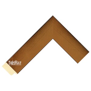 May include: A corner piece of a picture frame with a gold metallic finish. The frame is made of wood and has a black border. The BabyRice logo is visible on the frame.
