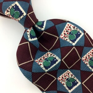 May include: A burgundy and blue silk tie with a repeating pattern of stick figures holding hands around a globe. The globe is green and blue with white outlines. The stick figures are holding red hearts.
