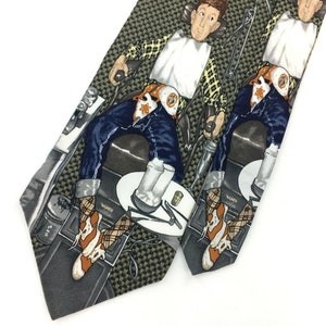 May include: A silk tie with a repeating pattern of a man sitting in a dentist's chair. The man is wearing a plaid shirt, blue jeans, and cowboy boots. The tie is in shades of green, brown, blue, and white.