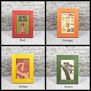 May include: Four picture frames with different colored frames and different images inside. The frames are red, orange, yellow, and green. The images are a "Do Not Disturb" sign, a cheese chart, a woman in a psychedelic outfit, and a mushroom illustration.