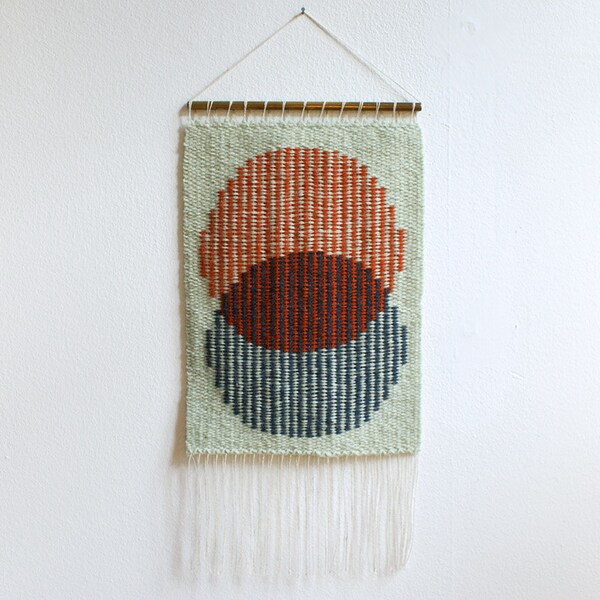 Handwoven tapestry wall hanging - orange/red and blue on mint base weaving