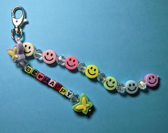 Ciondolo per borsetta con perline a forma di faccina sorridente arcobaleno - Stile anni '90