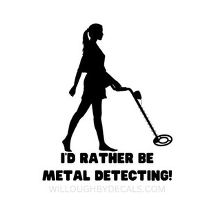 May include: Black and white silhouette of a person walking with a metal detector. The text "I'd rather be metal detecting!" is below the image. The website "willoughbybydecals.com" is below the text.