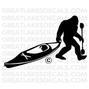 May include: Black and white silhouette of a Bigfoot carrying a kayak with a paddle. The text "GLDFS 2018" and a copyright symbol are visible in the lower right corner of the image.